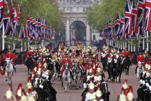 Queen+Elizabeth+rides+in+the+1902+State+Landau+carriage+as+she+leads+a+carriage+procession+through+central+London