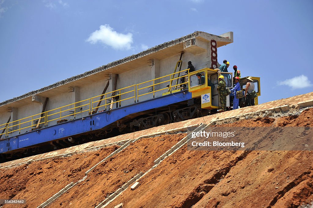 specialist-rail-wagon-carries-a-preformed-concrete-bridge-section-picture-id516342462