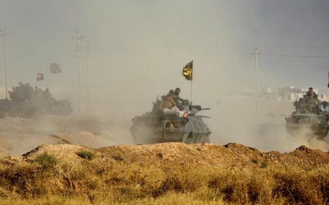 111347342_TOPSHOT_-_Iraqi_forces_deploy_in_the_area_of_al-Shourah_some_45_kms_south_of_Mosul_as-large_trans++-QHDtkn10EVHquJjKACpq3MG2_Cj9ELhbl7QWEQvwH8.jpg