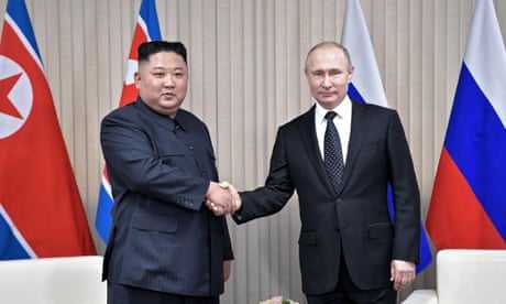 Kim Jong-un shakes hands with Vladimir Putin