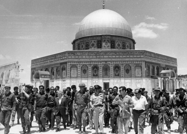 David Ben-Gurion, one of Israel's founders, and Israeli Army Chief of Staff Yitzhak Rabin with soldiers in front of the Dome of the Rock, in occupied East Jerusalem