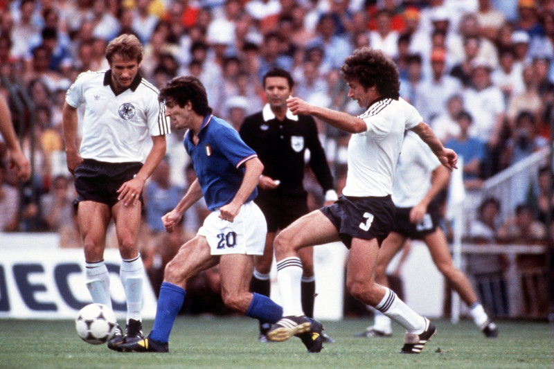 JUL 1982:  PAOLO ROSSI #20 OF ITALY IS HOUNDED BY PAUL BREITNER OF WEST GERMANY DURING THE ITALIANS 3-1 VICTORY IN THE 1982 WORLD CUP FINAL. Mandatory Credit: Tony Duffy/ALLSPORT
