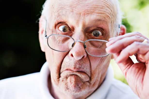 Suprising Grumpy-old-man-looks-over-spectacles-shocked-and-disapproving.jpg
