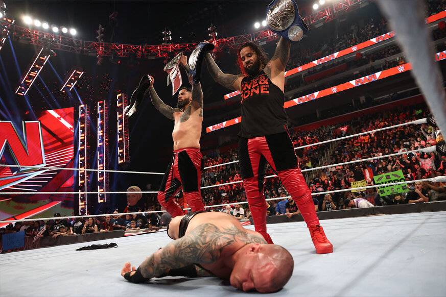 the-usos-standing-over-randy-orton.jpg