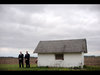 Secret Service agents stand outside in the freezing wind as Barack Obama and his family visit th.jpg