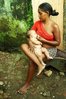 398px-Brazilian_favela_woman_breastfeeding.jpg