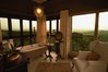 a-bathroom-with-panoramic-views-at-sasakwa-lodge.jpg