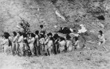 Naked_Jewish_women_wait_in_a_line_before_their_execution_by_Ukrainian_auxiliary_police.jpg