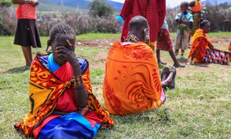 Exodus underway as Tanzania forces Maasai people from their ancestral lands, Narok, Kenya - 23 Jun 2022<br>Mandatory Credit: Photo by Daniel Irungu/EPA-EFE/Shutterstock (13008585m) Kenyan and Tanzanian Maasai women with their childre hold prayers outside a manyatta house at a remote village bordering Kenya and Tanzania in Narok, Kenya, 23 June 2022 (issued 27 June 2022). Thousands of Maasai people have been flocking to the border between Tanzania and Kenya in recent weeks, as the Tanzanian government continues its attempts to evict members of the Nilotic ethnic group from their ancestral lands in the northern town of Loliondo. More than 2,000 Maasai crossed the border between the two countries after the outbreak of violence on 10 June, according to Kenyan activists' count. The eviction of the communities in Loliondo in the northern district of Ngorongoro threatens more than 70,000 people, according to the United Nations. Exodus underway as Tanzania forces Maasai people from their ancestral lands, Narok, Kenya - 23 Jun 2022