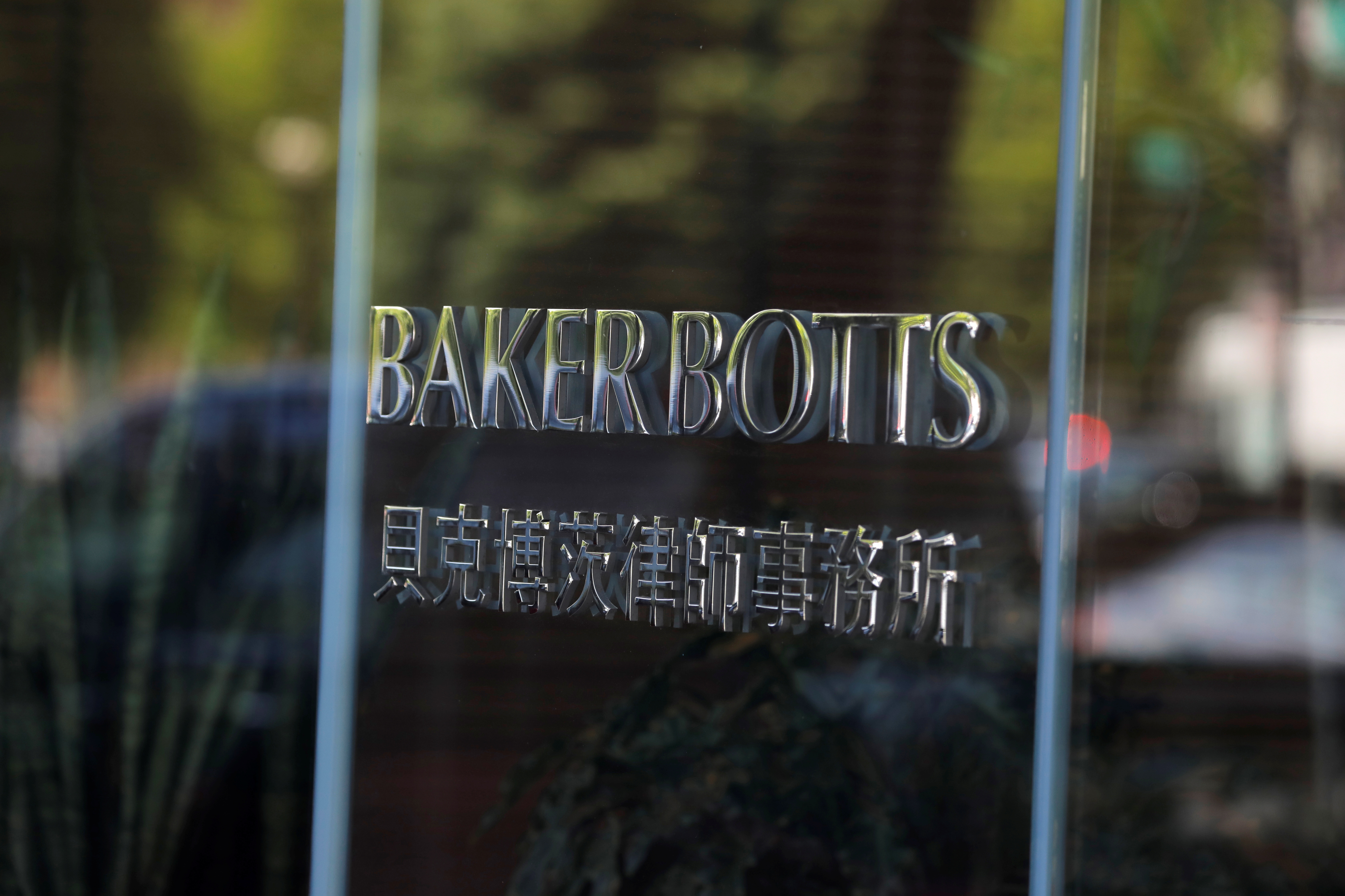 Signage is seen outside of the law firm Baker Botts at their legal offices in Washington, D.C., U.S., May 10, 2021. REUTERS/Andrew Kelly