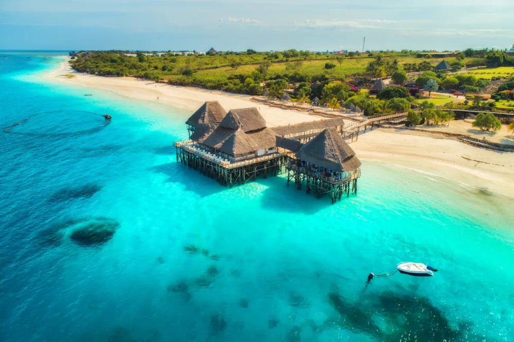 Aerial view of the dock and blue water and boats at Zanzibar, one of the best places to visit in Africa