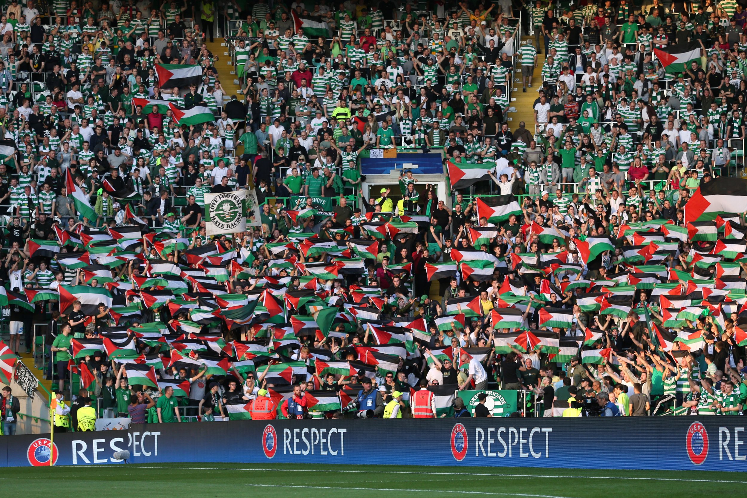 celtic-fans-hold-flags-against-hapoel-beer-sheva.jpg