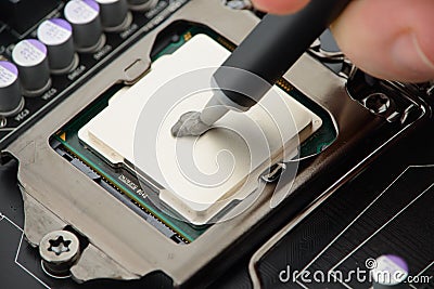 applying-thermal-paste-to-cpu-processor-motherboard-35129913.jpg