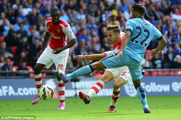 1407682190069_wps_9_Arsenal_s_Welsh_midfielde.jpg