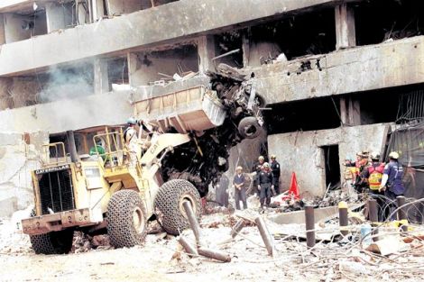 Rescue workers remove the remains of the car bomb that destroyed the US embassy in Nairobi on August 7, 1998. More than 200 people were killed in the attack.