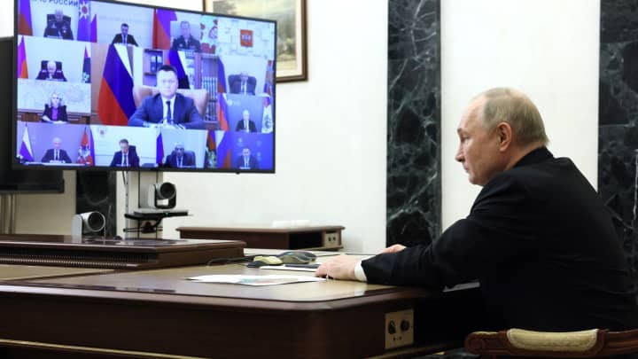 In this pool photograph distributed by the Russian state agency Sputnik, Russia's President Vladimir Putin holds a meeting on measures taken after a massacre in the Crocus City Hall that killed more than 130 people, the deadliest attack in Europe to have been claimed by the Islamic State (IS) group, via a videoconference at the Novo-Ogaryovo state residence, outside Moscow, on March 25, 2024.'s President Vladimir Putin holds a meeting on measures taken after a massacre in the Crocus City Hall that killed more than 130 people, the deadliest attack in Europe to have been claimed by the Islamic State (IS) group, via a videoconference at the Novo-Ogaryovo state residence, outside Moscow, on March 25, 2024.