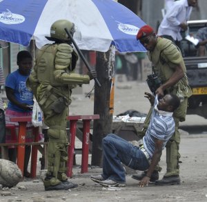 police-arresting-tanzanian-rioter-photo-credit-khalfan-said.jpg