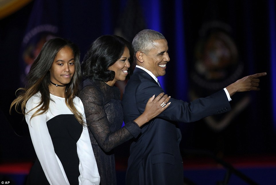 3C097BC800000578-4105722-Obama_points_to_the_crowd_as_he_is_joined_by_First_Lady_Michelle-a-8_1484116414001.jpg