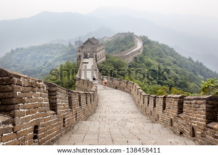 stock-photo-thousands-of-tourists-visit-daily-the-chinese-wall-a-family-walking-on-the-great-wall-of-china-138458411.jpg