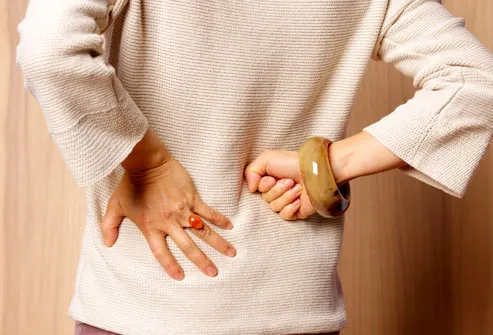 getty_rm_photo_of_woman_holding_back.jpg