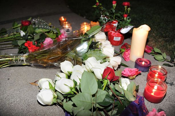 Flowers+and+candles+are+left+by+fans+of+US+singer+Whitney+Houston+on+the+street+outside+the+Beverly+Hilton+Hotel