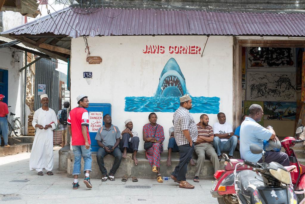 tanzania coronavirus covid-19: People gather on a corner in Stone Town, Zanzibar. Credit: Frans Peeters.