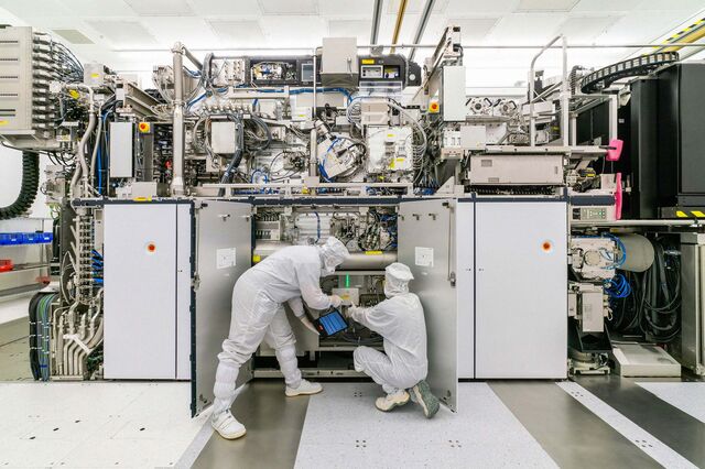Employees assemble a lithography machine at the ASML Holding NV factory