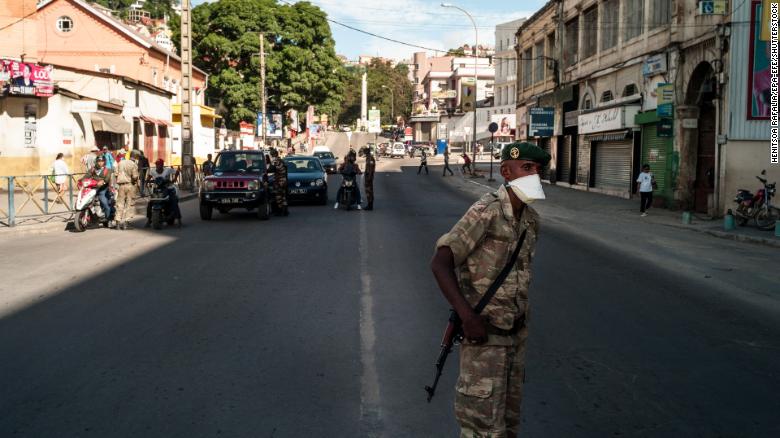 A member of the National Defense Force stands at a checkpoint as part of measures put in place to combat the spread of coronavirus in Antananarivo, Madagascar, in March.