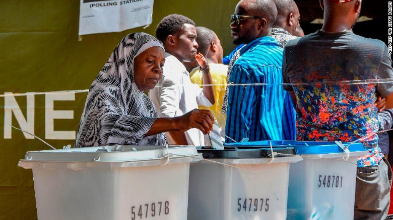 A voter casts her ballot at Wazo Hill polling station in Dar es Salaam, Tanzania, on October 28.