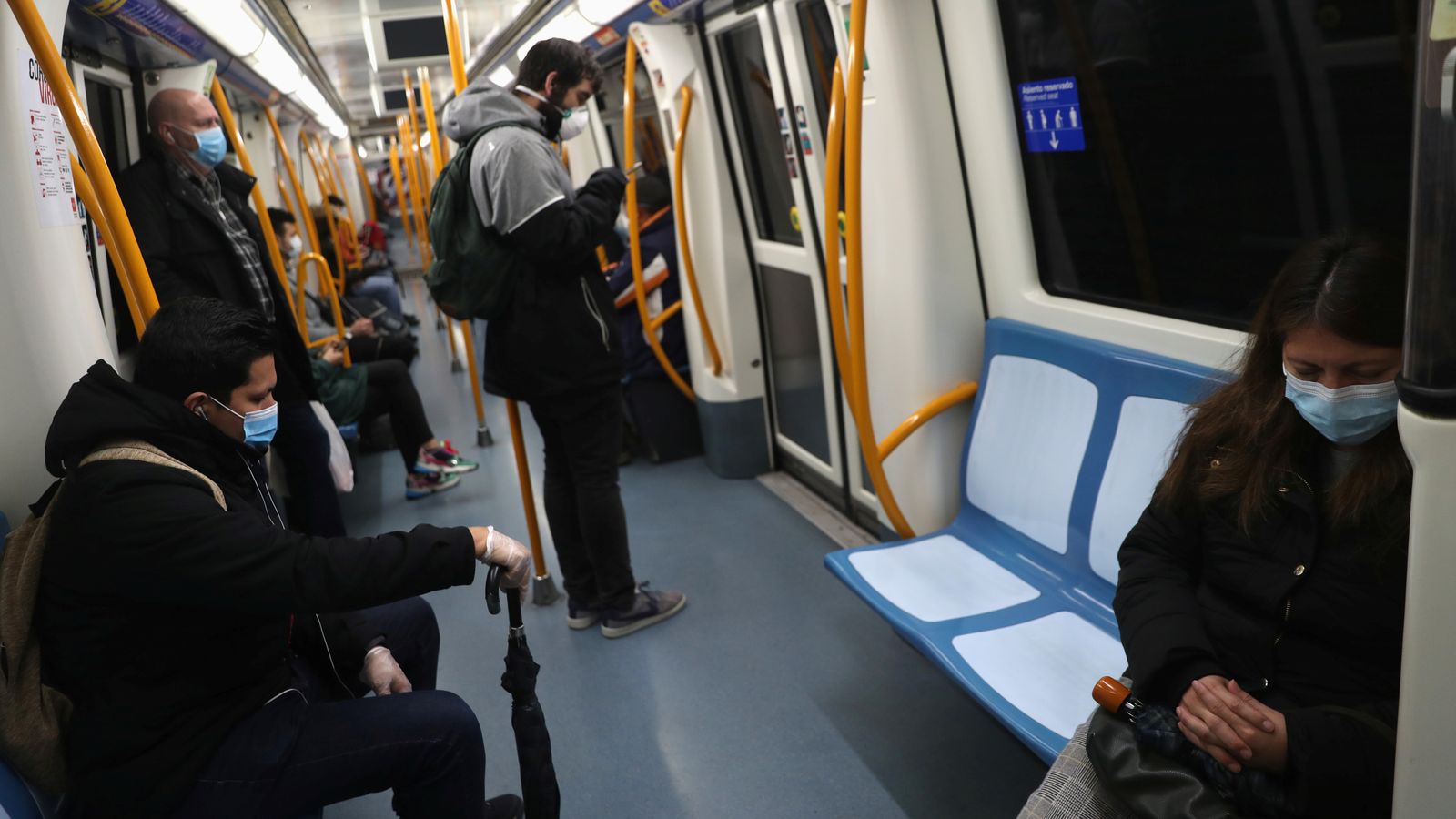 Passengers keep social distance as they ride the metro