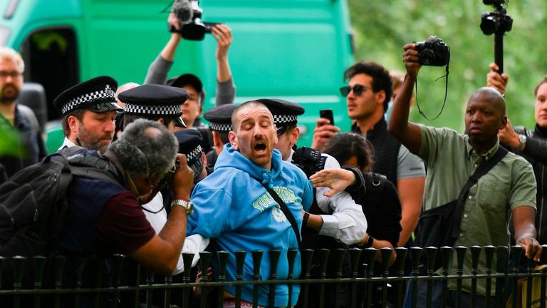 A man is arrested by police as media with cameras and smartphones surround at an anti-coronavirus lockdown demonstration in Hyde Park in London on May 16, 2020, following an easing of lockdown rules in England during the novel coronavirus COVID-19 pandemic. - Fliers advertising 'mass gatherings' organised by the UK Freedom Movement to oppose the government lockdown measures and guidelines put in place to halt the spread of coronavirus in parks around the UK calling for attendees to bring a picni'mass gatherings' organised by the UK Freedom Movement to oppose the government lockdown measures and guidelines put in place to halt the spread of coronavirus in parks around the UK calling for attendees to bring a picni