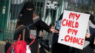 Parents, children and protestors demonstrate against the lessons about gay relationships, which teaches children about LGBT rights at the Anderton Park Primary School, Birmingham.