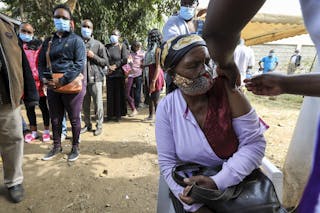 A person being vaccinated against COVID-19 in Kenya