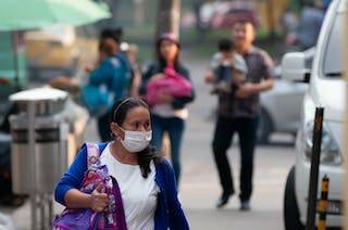 A Colombian woman wearing a facemask