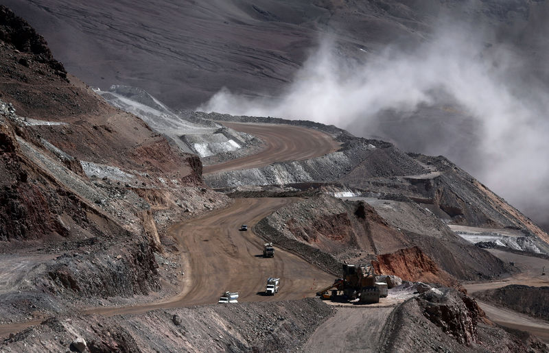 FILE PHOTO: Dump trucks operate at Barrick Gold Corp's Veladero gold mine in Argentina's San Juan province