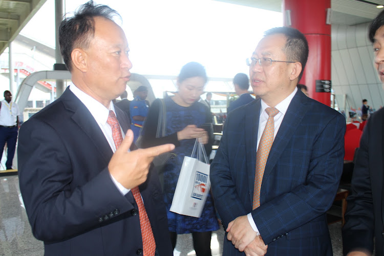 Africa Star Railway Operation Company General Manager Li Jiuping with Embassy of China in Kenya Minister Counselor Guo Ce at SGR Nairobi Terminus yesterday/ANDREW KASUKU