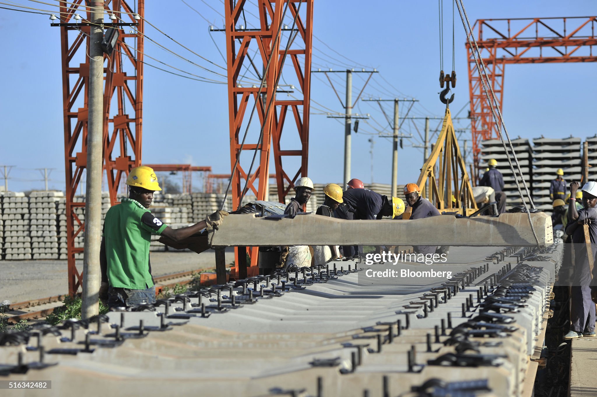 african-workers-build-railway-track-sections-at-the-kathekani-tgirder-picture-id516342482