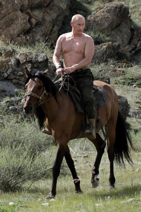 Russian Prime Minister Vladimir Putin rides a horse during his vacation outside the town of Kyzyl in Southern Siberia on August 3, 2009. AFP PHOTO / RIA-NOVOSTI / ALEXEY DRUZHININ / ADDITIONAL CROP VERSION (Photo credit should read Alexsey Druginyn/AFP via Getty Images)