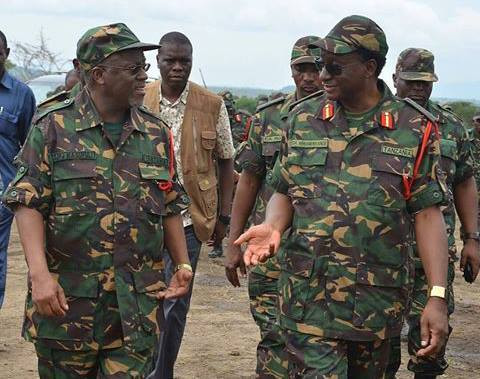 Tanzania's President John Magufuli (L) in full military gear. (BigEye) 