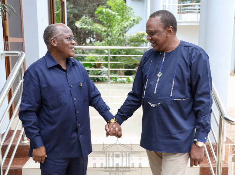 President John Magufuli holding hands with President Uhuru Kenyatta