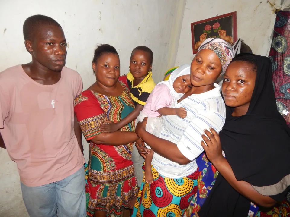 Family members of Rabia Issa gather Dec. 9 at their home in the Msasani neighborhood of Dar es Salaam, Tanzania.