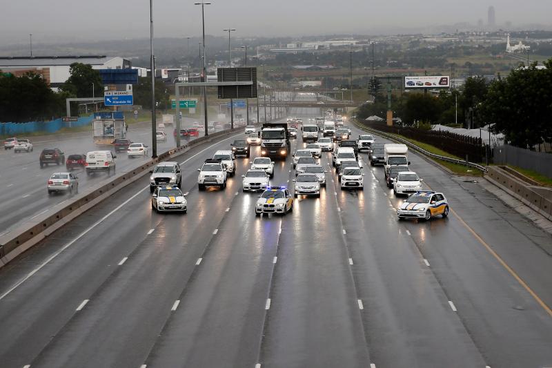 FILE PHOTO: South African law enforcement agancies block motorists in Johannesburg on Feb 1, 2021 to make the highway clear for refrigerated trucks transporting AstraZeneca vaccines for the Covid-19 coronavirus that arrived at OR Tambo International Airport in Johannesburg. (AFP)