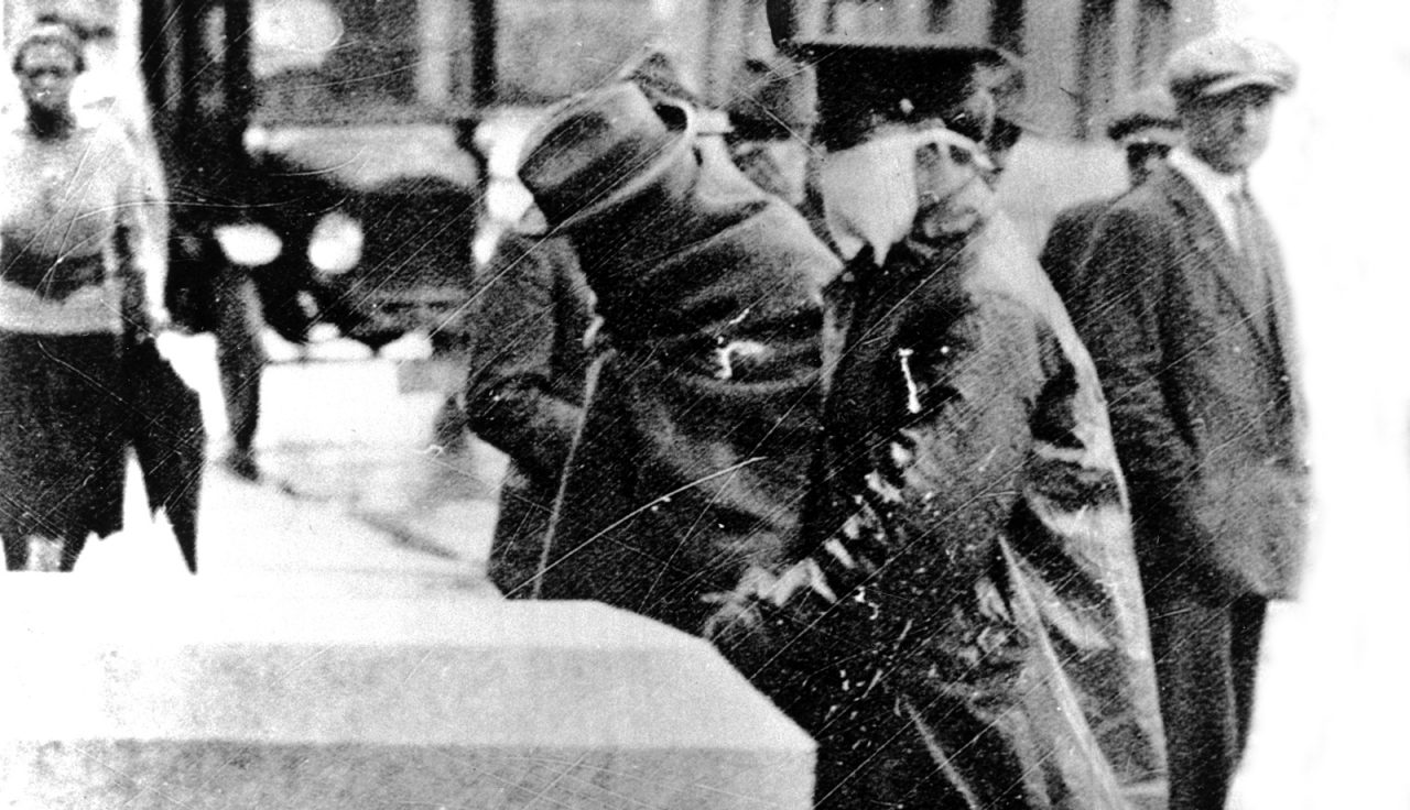 A Philadelphia patient is escorted by police. (Courtesy of Temple University Libraries, Urban Archives, Philadelphia.)