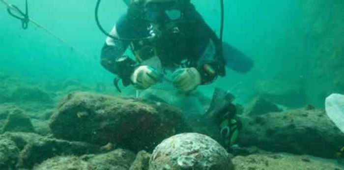 Head of archaeology National Museum of Kenya Ceasar Bita excavates a wreck site.