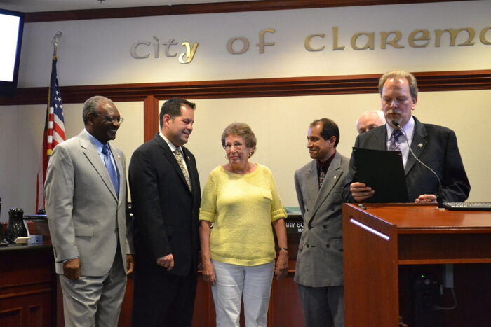 Opanyi Nasiali (left) during a council vote at the Claremont City Council chambers on June 13, 2012.