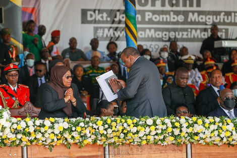 President Uhuru Kenyatta greeting Tanzania's President Samia Suluhu during the funeral service of the Late John Magufuli