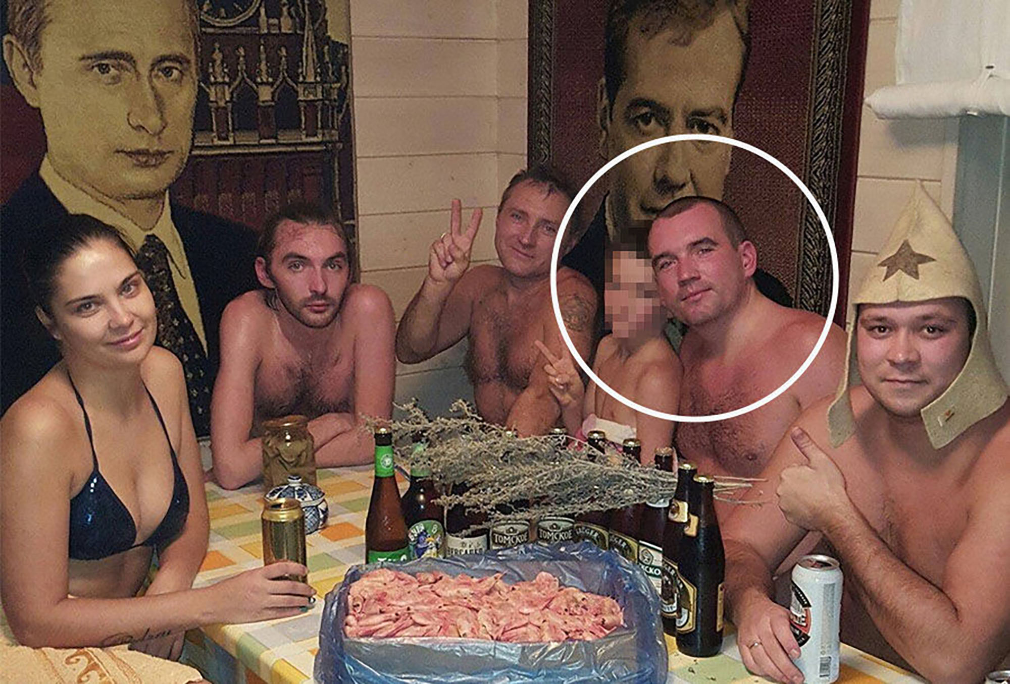 Vladimir Timofeev, 40, pictured at a sauna party at a bizarre bath house next to giant rugs with Putin's face